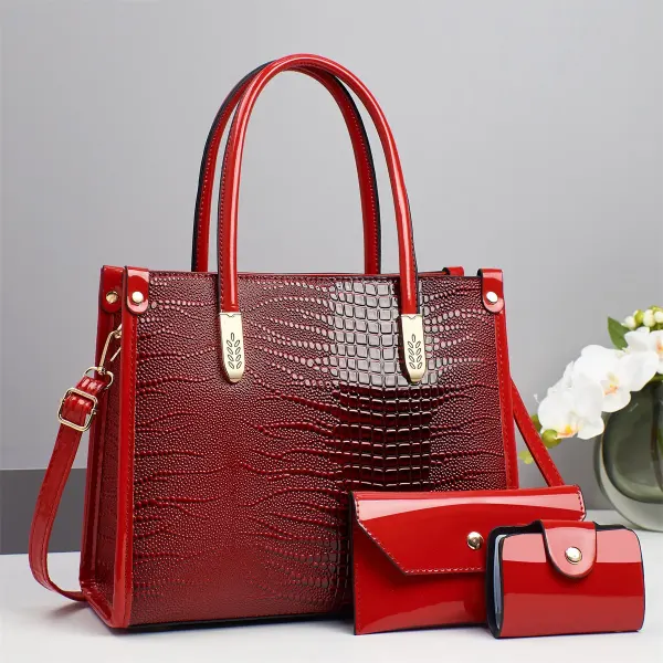 Wine croc-embossed tote with two handles, a long strap and two matching accessories