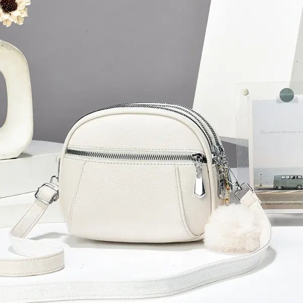 Women’s Solid Color Round Crossbody Bag In PU Leather With Fluff Ball And Single Shoulder Strap