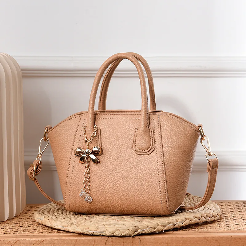Women’s Dome Bag With Shell Shape Featuring Bow Tie Accent In PU Leather