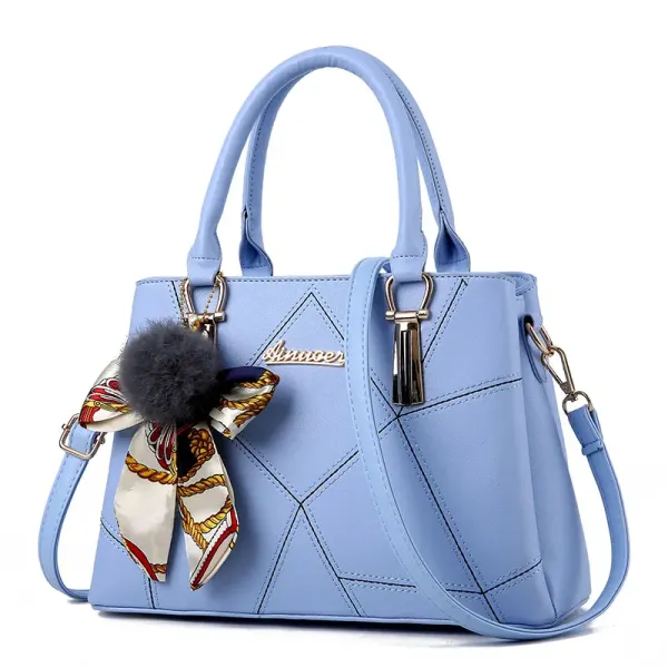 Sky Blue handbag with angular front stitching, two short handles and a long strap