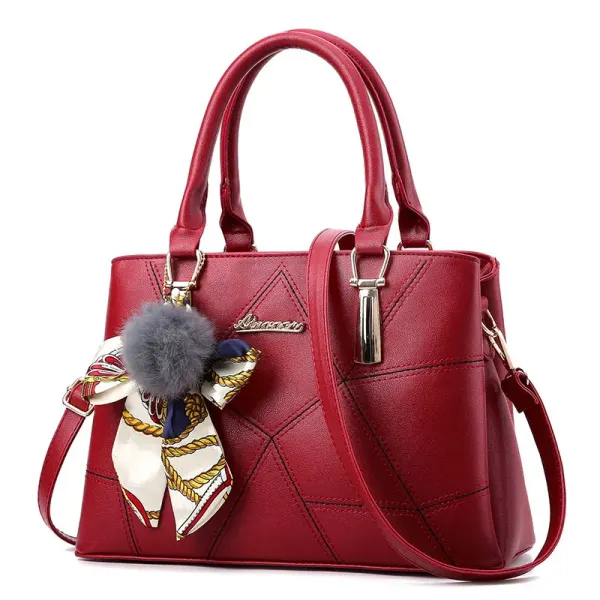 Wine handbag with angular front stitching, two short handles and a long strap
