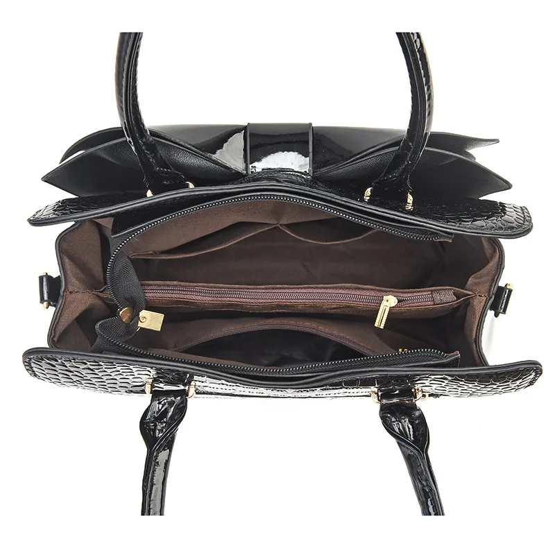 Top view of the Jet Black handbag; zippered main opening visible in image 3.