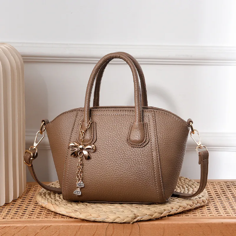Women’s Dome Bag With Shell Shape Featuring Bow Tie Accent In PU Leather