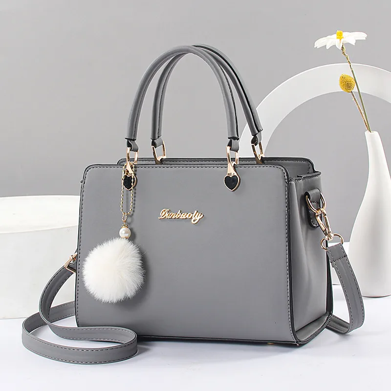 Fashion Large Solid Color Women Top Handle Bag In PU Leather With Fluff Ball And Zipper Closure