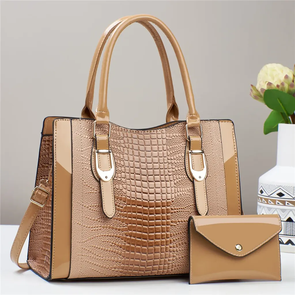Tan croc-embossed handbag with two top handles and matching pouch