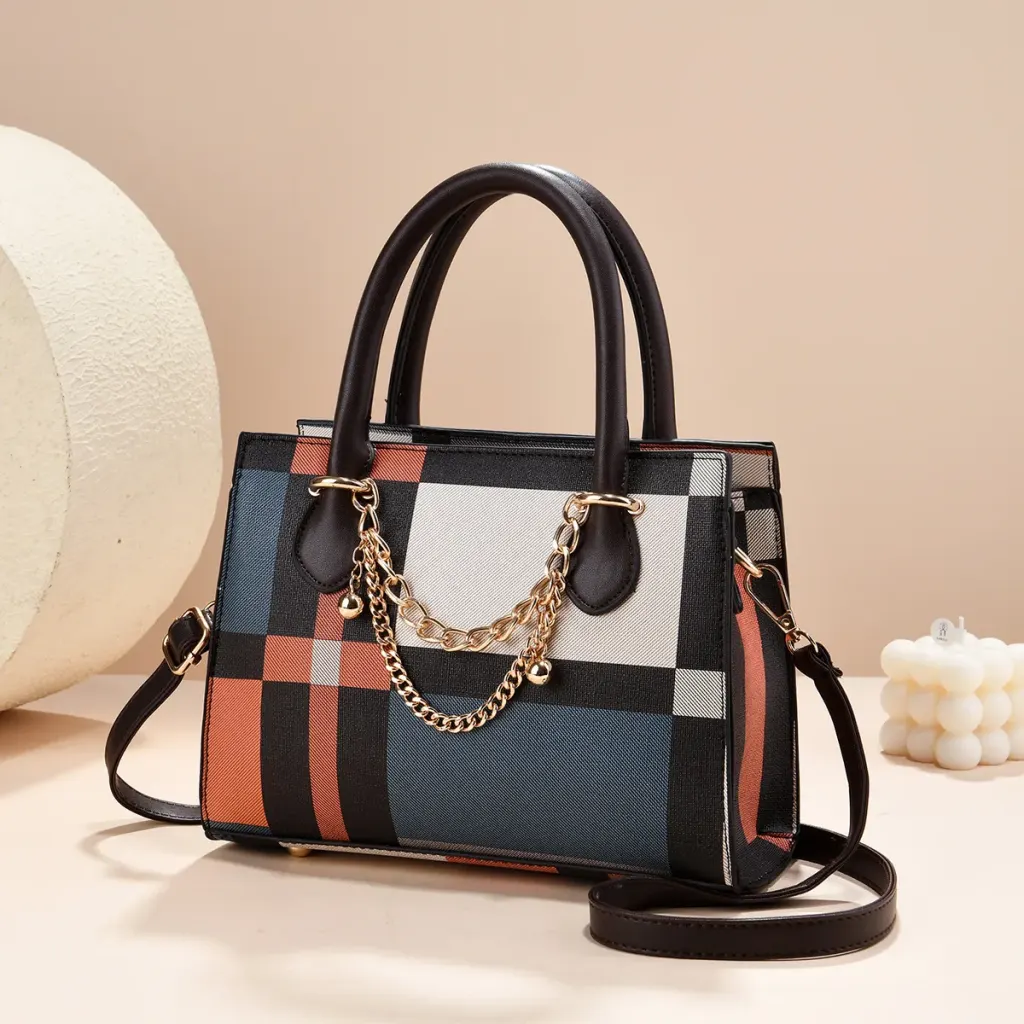Plaid canvas tote bag with contrasting trim, top handles, a shoulder strap and gold-tone chain details.