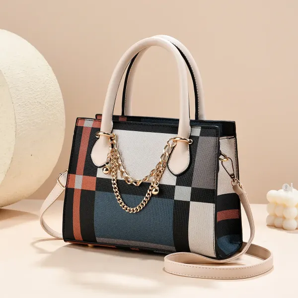 Plaid canvas tote bag with contrasting trim, top handles, a shoulder strap and gold-tone chain details.
