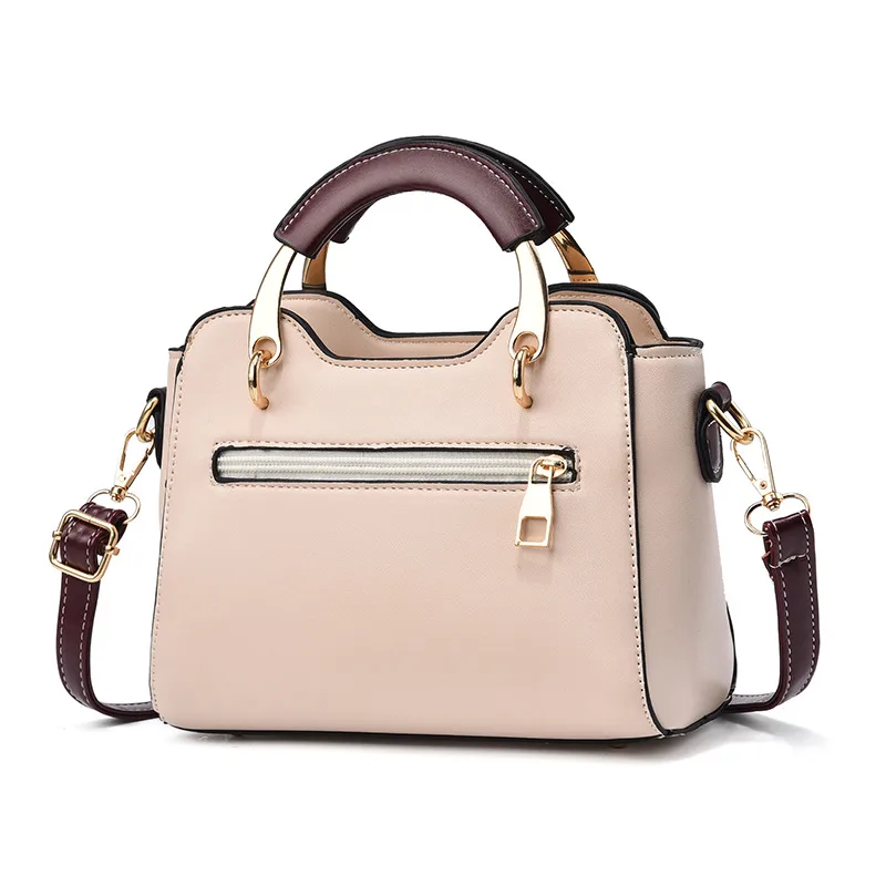 Rear view of a light handbag with an attached long strap