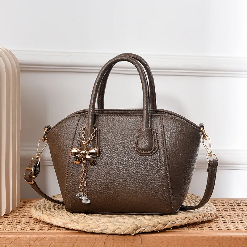 Women’s Dome Bag With Shell Shape Featuring Bow Tie Accent In PU Leather