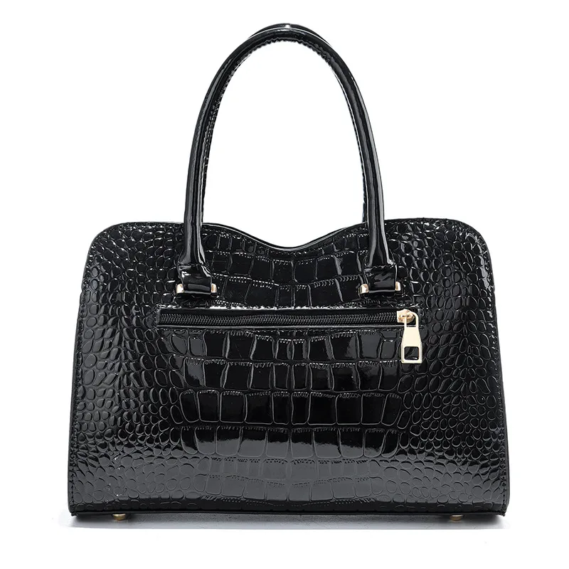 Back of the Jet Black croc-embossed handbag with two handles.