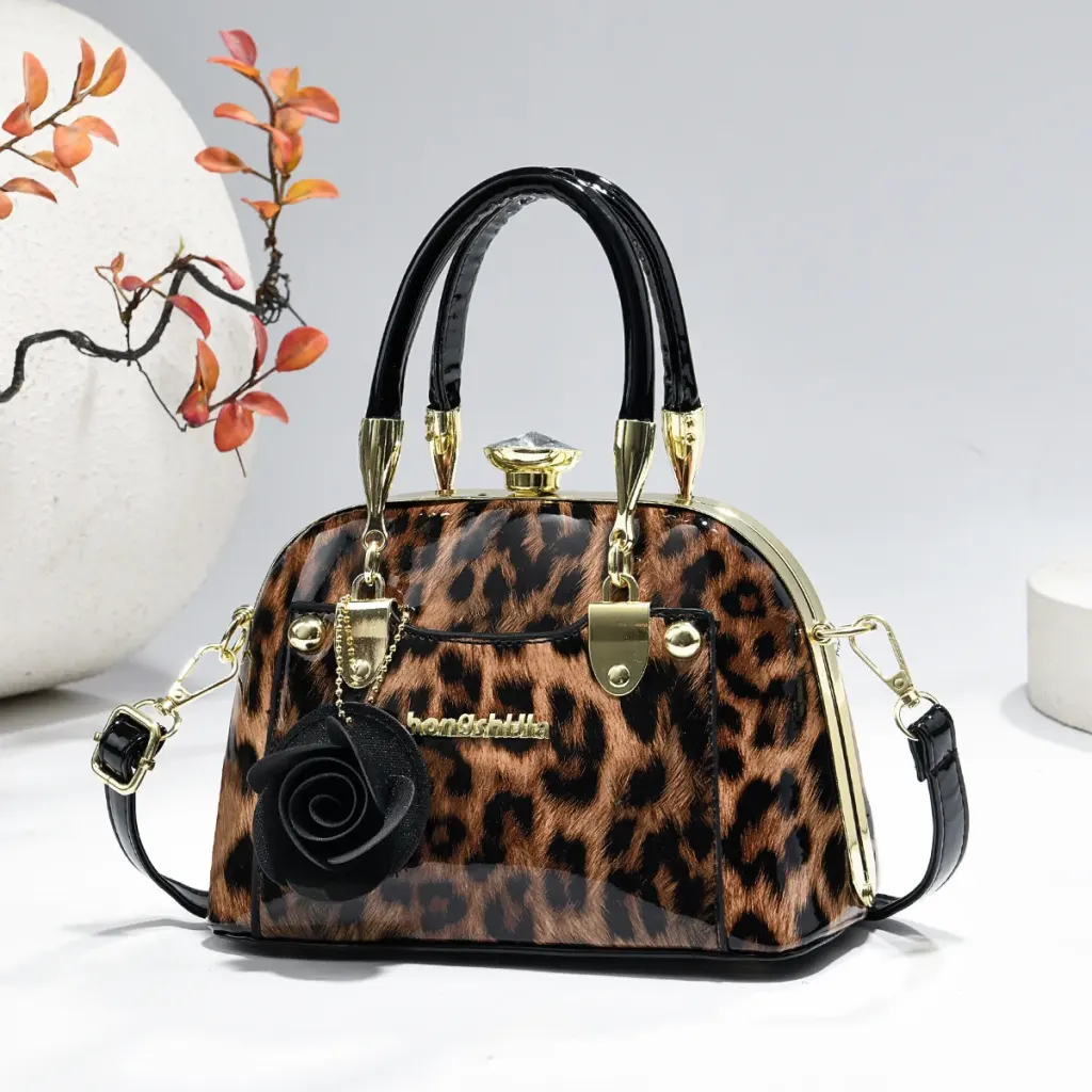 Women’s Dome Bag In Patent Leather With Shell Shape And Sewing Thread Detail, Featuring Top Handle